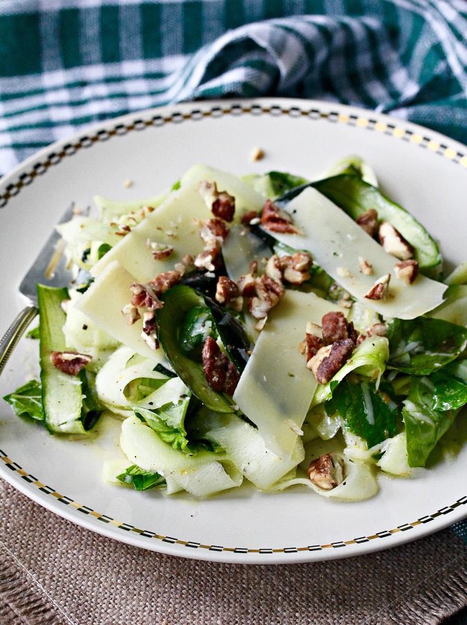 This Zucchini Parmesan Salad is an wonderful combination of raw zucchini topped with shaved Parmesan and candied pecans, and dressed with a bright lemon dressing.
