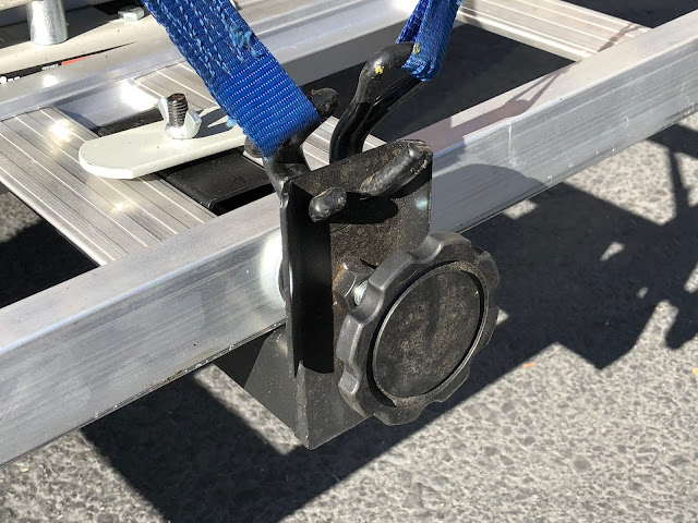 detail showing how tie down straps attach to haul master motorcycle carrier