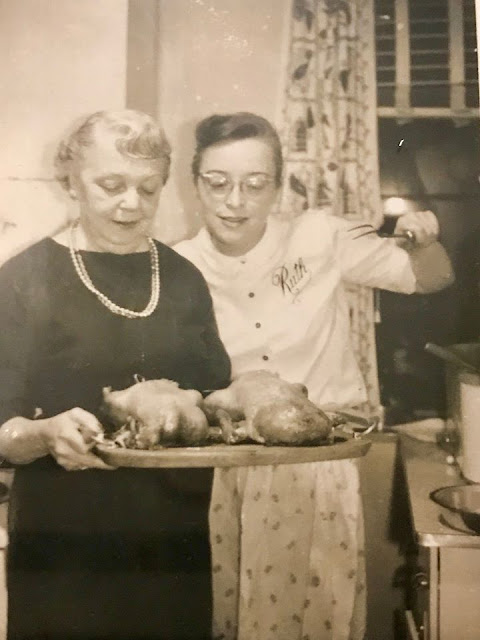 black and white photo of Irma Simpson DeHaven and her daughter, Ruth DeHaven, in the kitchen