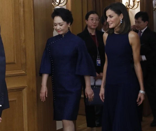 Queen Letizia wore Felipe Varela skirt and top and Nina Ricci pumps. Peng Liyuan. Queen Victoria Eugenia's Cartier diamond earrings