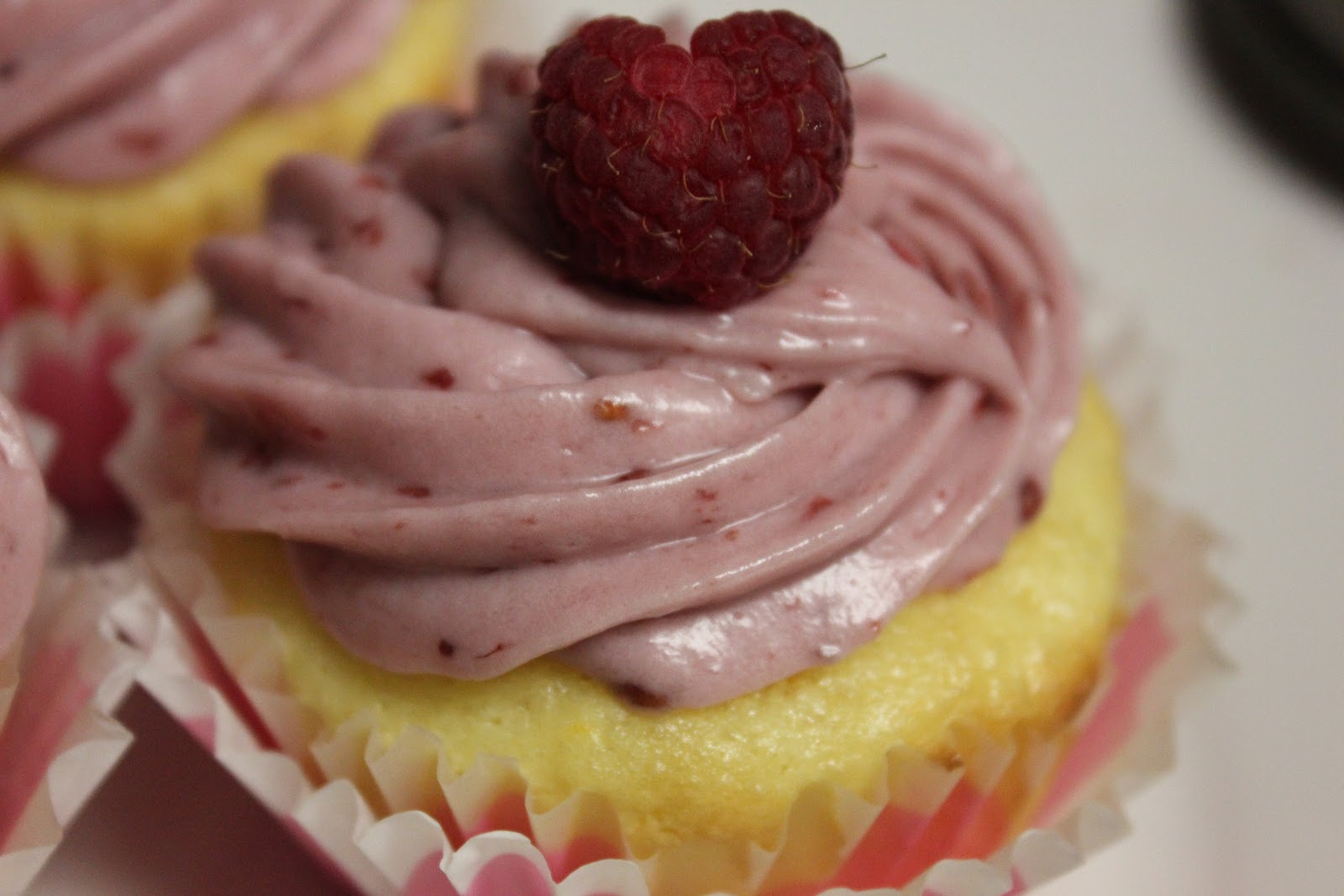 Girls in Aprons: Orange cupcakes with raspberry cream cheese frosting