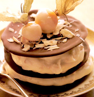 Chocolate hazelnut galettes: Classic french dessert of chocolate rounds sandwiched with fromage frais and ground hazelnuts topped with a white chocolate dipped physalis.