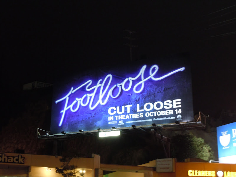 Footloose neon billboard at night