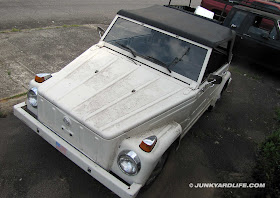 White with black convertible top and it's a 4-door.