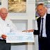John Surtees OBE presents £75,000 to local Air Ambulance charity