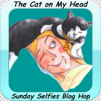 http://thecatonmyhead.com/