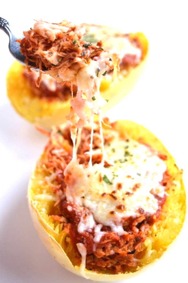 Chicken Parmesan Stuffed Spaghetti Squash is a much healthier but still delicious version of your favorite chicken parm. The chicken is cooked in the slow cooker to make it easy! www.nutritionistreviews.com