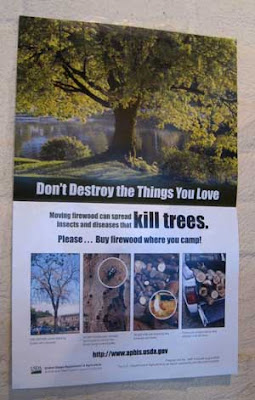 Poster telling people not to move fire wood across state lines