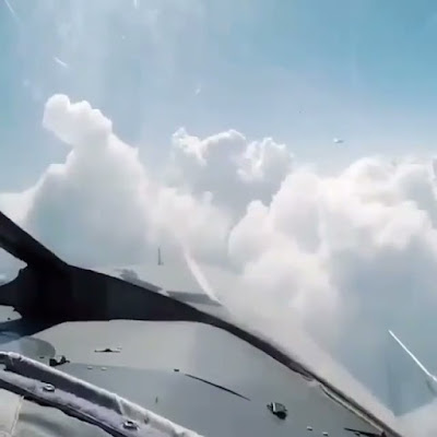 UFO diving through the clouds to get away from the Jet. UFO diving through the clouds to get away from the Jet.