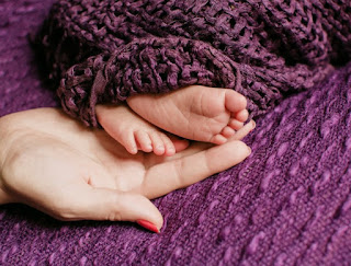 http://www.freepik.com/free-photo/woman-hand-touching-baby-feet_1211933.htm#term=mother%20and%20child&page=2&position=39