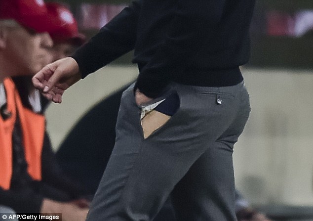 Zinedine Zidane flashes the world after his trousers rip on the Real Madrid touchline