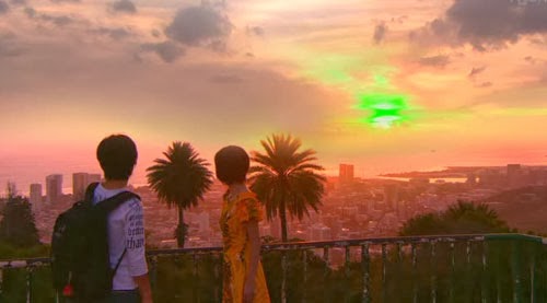 Nakahara and Misaki look at the green sunset from Punchbowl Crater.