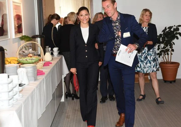 Crown Princess Victoria attended the meeting of Swedish Leadership for Sustainable Development at Sida headquarters. House of Dagmar clutch bag, Dagmar red suede pumps
