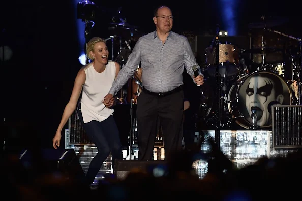 Princess Charlene of Monaco and Prince Albert II of Monaco attend the show of British singer Robbie Williams during celebrations marking Prince Albert II's decade on the throne