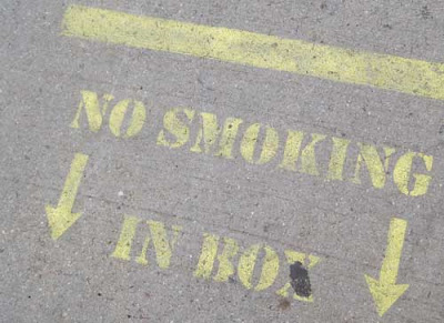 Close up of the lettering, which reads No smoking in box