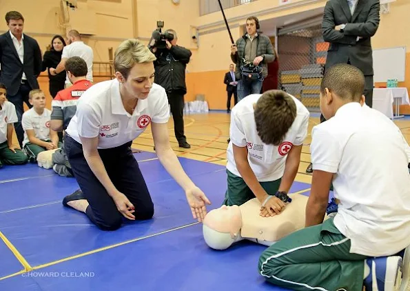 Princess Charlene of Monaco taught water safety and life saving first aid techniques after facing drowning danger to young rugby players who have come to Monaco from South Africa