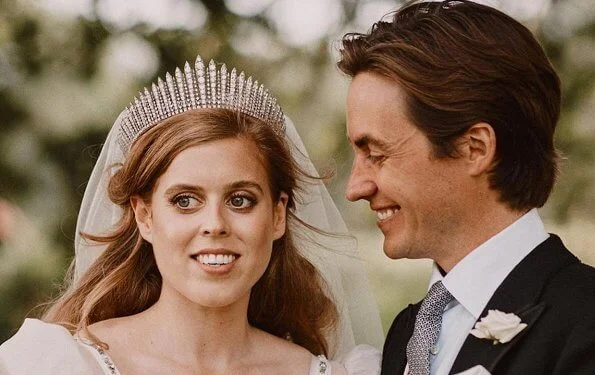 Princess Beatrice wore a vintage dress by Norman Hartnell and the Queen Mary diamond fringe tiara. Wedding of Princess Beatrice