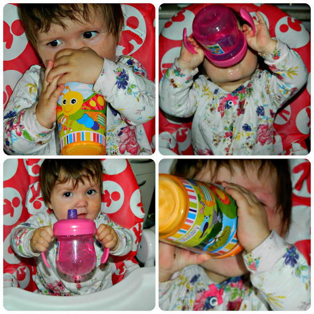 Baby girl drinking from her TOMY Lamaze cups