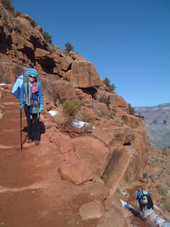 woman backpacking on a trail in the grand canyon