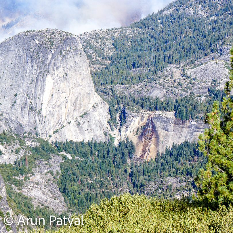 There are lot of waterfalls in Yosemite National Park and one of them is visible in above photograph. While roaming around the national park you come across some of the brilliant views with many waterfalls coming down from these huge mountains and rock shapes. 