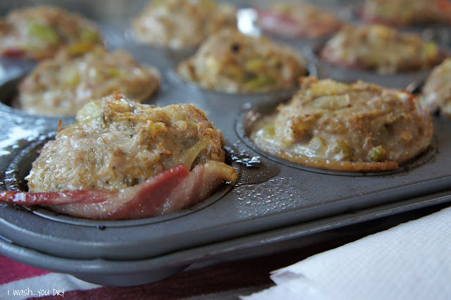 A close up of baked bacon lined meatloaf muffins in a muffin tin. 