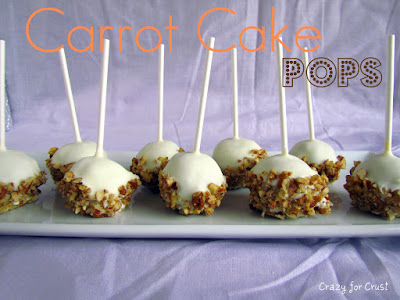 carrot cake pops covered in white chocolate and pecans with sticks sticking up on purple background 