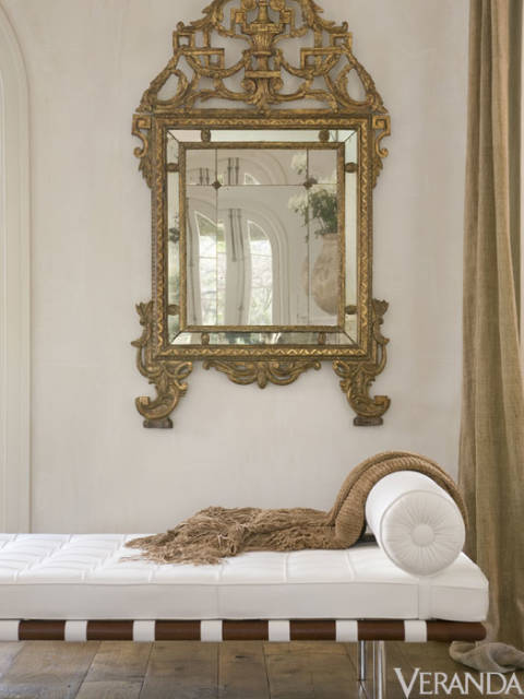 Pamela Pierce designed interior with modern daybed and gilded mirror.