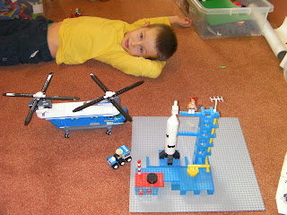 lego rocket with launchpad and radar tower