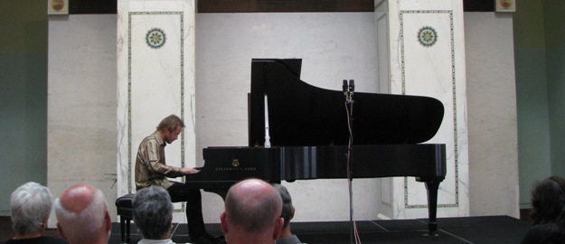 Pianist Samuel Deason performing during a Dame Myra Hess Memorial Concert in Preston Bradley Hall at the Chicago Cultural Center in Chicago, Illinois Pianist Samuel Deason performing during a Dame Myra Hess Memorial Concert in Preston Bradley Hall at the Chicago Cultural Center in Chicago, Illinois