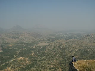 Hiker sit peacefully admiring the view at the Channarayana Durga trek
