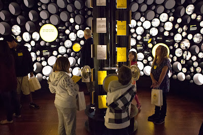 Schoolchildren explore an installation during a launch event for the Bezos Center for Innovation at the Museum of History and Industry in Seattle, Washington.