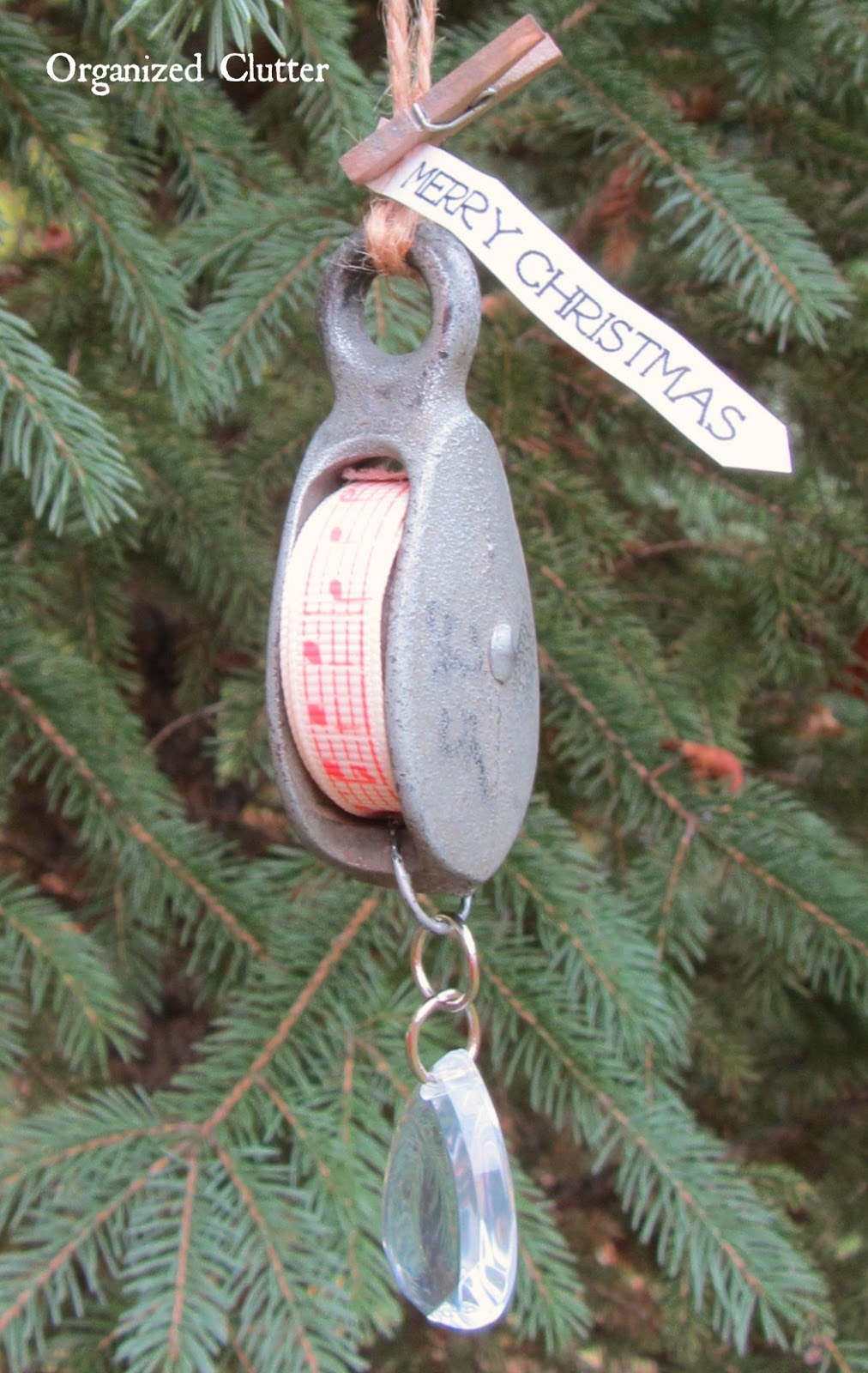 Christmas Ribbon on a Repurposed Pulley www.organizedclutterqueen.blogspot.com