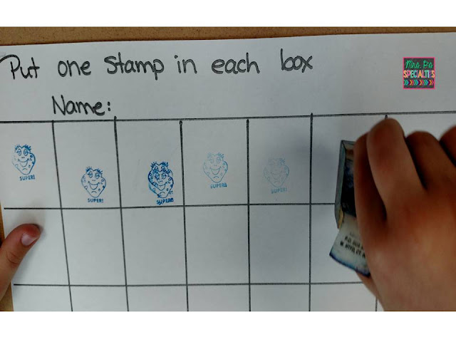 photo of student stamping into boxes on a worksheet