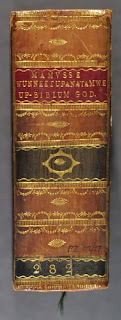 The leather spine for the Eliot Bible.