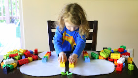 A fun and simple lesson on symmetry using LEGOs and a sticky-winged butterfly from Fun at Home with Kids