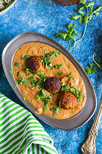 Bottle gourd dumplings in a tomato based gravy