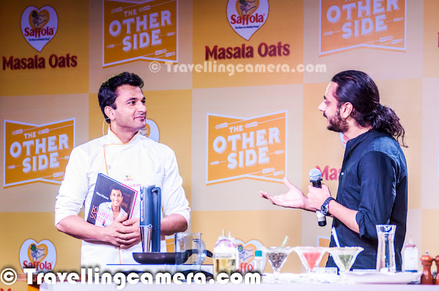  Yesterday we had an invite to participate in a Blogger Meet organized by Saffola Masala Oats and Vikas Khanna was main guest there. He flew from US to India for this event and it was really an exciting opportunity for us to interact with one of the best Chefs in the world. After meeting I found him a great person as well.Let's check out this Photo Journey and know more about my personal experiences of this sepcial day with Bindas Punjabi who is based in US now.   Usually such blogger meets are great ways to interact with other bloggers from North India, but this time most of the bloggers were excited to meet Vikas Khanna in Person. Almost every blogger was on time and as expected Chef Vikas Khanna made us wait for some time but it was worth. As he joined us at Blue Frog with his amazing smile, the whole environment changed immediately. Probably I was least aware of him. I knew very basic stuff about him and everyone else had probably all details about his past life and his lifestyle. Girl Bloggers were really mad about the event and we could literally see lot of unusual stuff that doesn't happen during other meets. Anyways, it was great to meet him in person and understand the great Chef.   I loved when we started talking in Punjabi & Hindi, although he couldn't control to talk in English in between. His style was awesome and he was continuously cracking some subtle Punjabi jokes in between. Of course, he shared some great tips about food and how different ingredients can be used in innovative way.   Born in Amritsar, Vikas Khanna began his culinary experience as a helper in his grandmother's kitchen and learned the art of cooking & the use of spices from her. He talked about his mom many times and related food with love. And had some great views about food and mothers who feed the whole family with love. He began developing recipes at a very young age. He graduated from the Welcomgroup Graduate School of Hotel Administration and established SAANCH, a cultural festival gala, to bring together various foods and traditions from different parts of India. This festival has been an important event in the college's calendar. He has worked for the Taj, Oberoi, Welcomgroup and Leela Group of Hotels and with some of the most influential chefs of the world including Gordon Ramsay, Bobby Flay, Jean-Georges Vongerichten.  Above photograph shows Vikas interacting with bloggers who participated in cooking contests. And there were two contestants out of 12. He really impressed everyone out there. Chef Vikas Khanna completed his graduation from Welcomgroup Graduate School of Hotel Administration also known as WGSHA, Manipal.He has also studied at Cornell University, Culinary Institute of America, and New York University. Vikas also appears in Marquis Who's Who in America 2012 edition.    He himself made two dishes and talked a lot of Tindas :). And I can't believe the depth he reached while talking about tindas and various ways to cook it. btw, Saffola Masala Oats were the highlight of the event. Second round of cooking involved dishes created with Oats. Vikas met all contestants, talked about their ideas and tasted their dishes. Oat Pizza was one of his favorites which also won the contest. Check out more about Vikas Khanna @ http://en.wikipedia.org/wiki/Vikas_Khanna