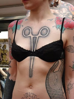 Scissors In The Middle Of Breast Tattoos