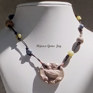 http://www.artfire.com/ext/shop/product_view/BijouxGemsJoy/9782990/birdsong_necklace_ceramic_olive_jade_sponge_corral__tn14008/design/jewelry/necklaces/gemstone