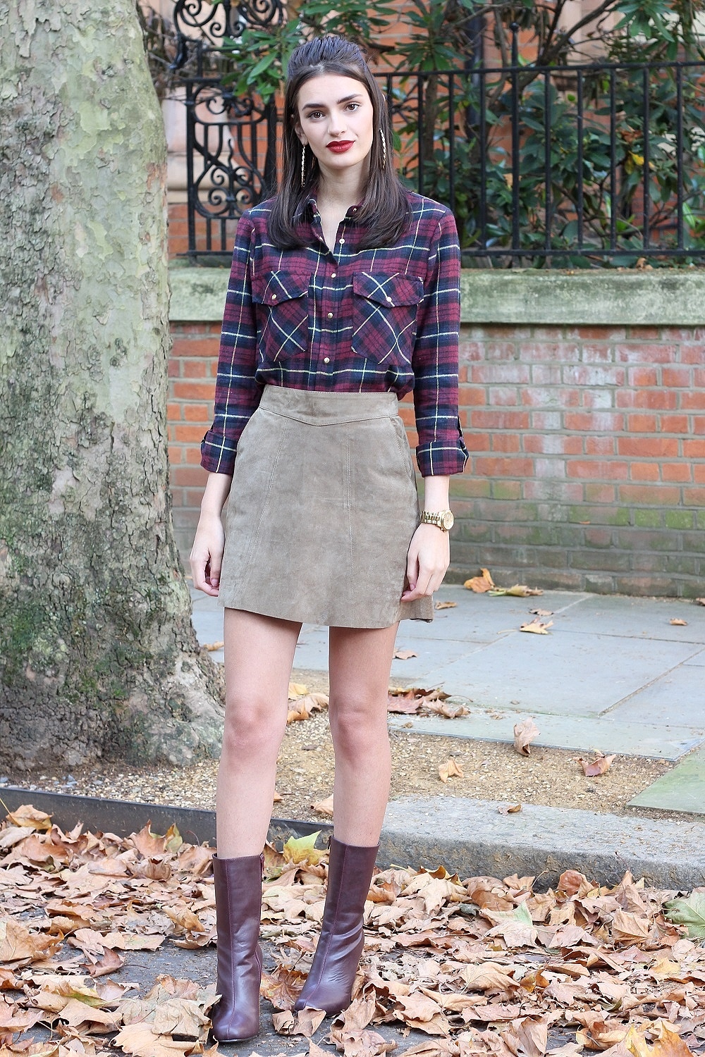 peexo fashion blogger wearing checkered shirt and suede skirt and purple boots