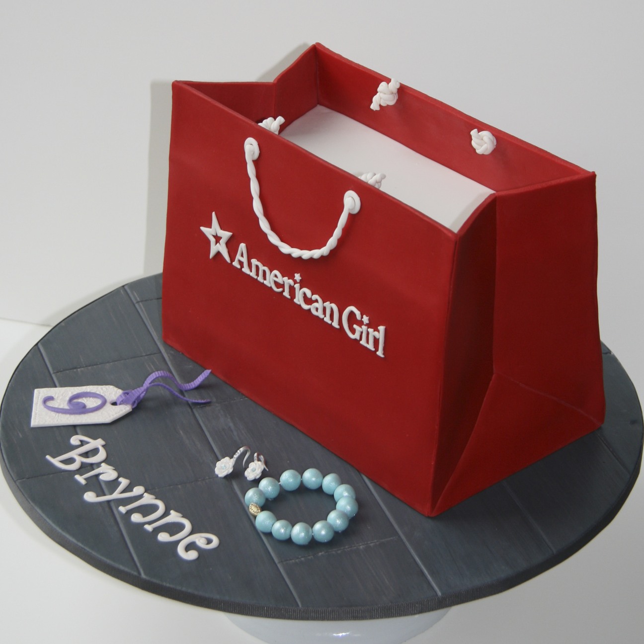 Sweet cake design american girl shopping bag cake