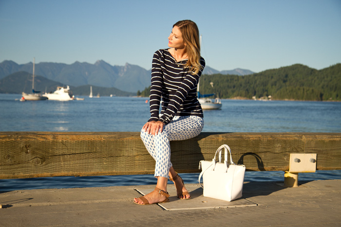 Vancouver Fashion Blogger, Alison Hutchinson, is wearing a striped H&M top, printed J.Crew pants, nude Zara sandals and a white Zara bag