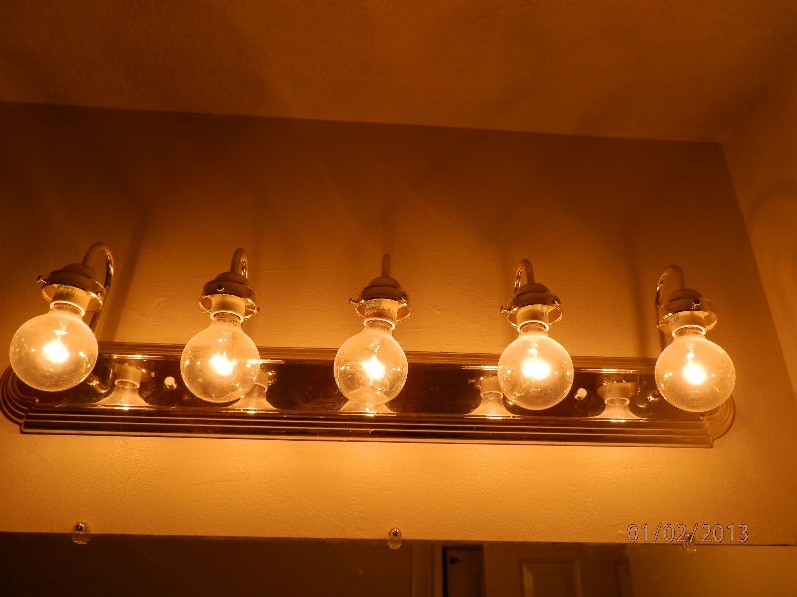 Cluff's Are Home Spray Painting Light Fixtures