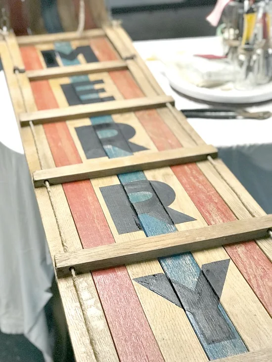MERRY painted on a wooden toboggan
