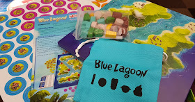 What is in the box for Blue Lagoon game tokens models cloth bag