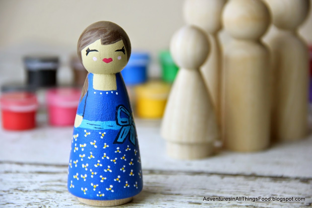 painted wooden peg dolls
