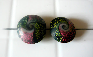 Polymer clay lentil swirl beads after cooking