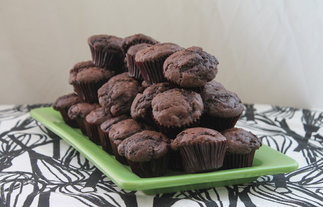 Food Lust People Love: These Chocolate Chocolate Chip Mini Muffins are made from rich chocolate batter with lots of extra chocolate chips. But because they are mini sized, they are perfect as a party snack or buffet table dessert.