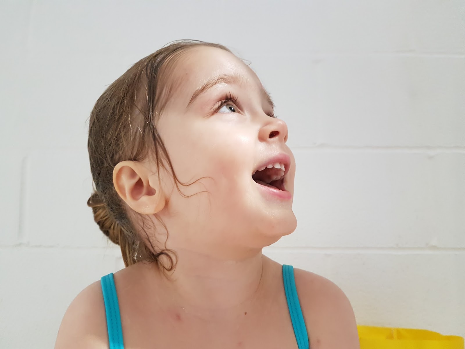 girl smiling at swimming pool at butlins minehead