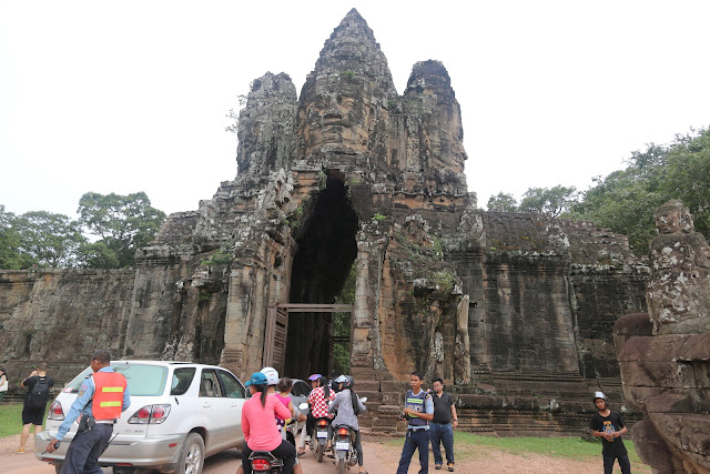 A closer look at the entrance gate with the stone face of Bayon Temple in Angkor Province of Siem Reap, Cambodia A closer look at the entrance gate with the stone face of Bayon Temple in Angkor Province of Siem Reap, Cambodia
